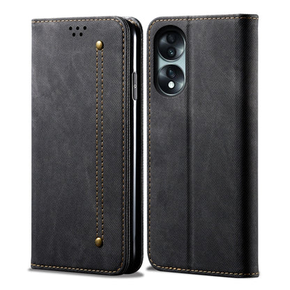 Black denim-texture flip phone case with stitched panel and dual camera cutout.