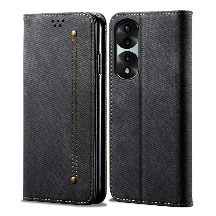 Black denim-textured leather flip phone case with stitched corners and snap strap