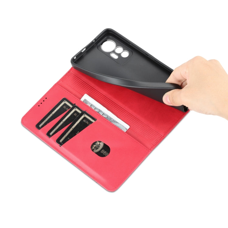 Red leather-style wallet phone case with card slots, hand lifting back cover