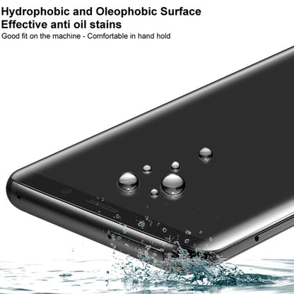 Curved tempered glass screen protector with water-repellent surface and droplets