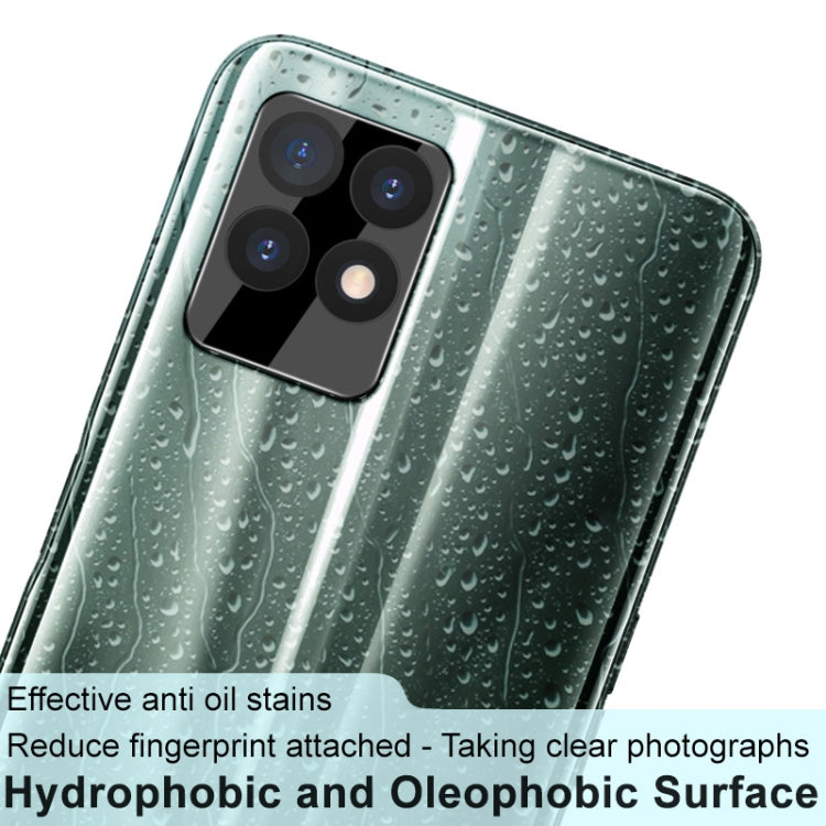 Black rear camera lens tempered glass film with lens cap fitted on smartphone