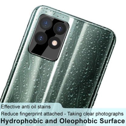 Black rear camera lens tempered glass film with lens cap fitted on smartphone