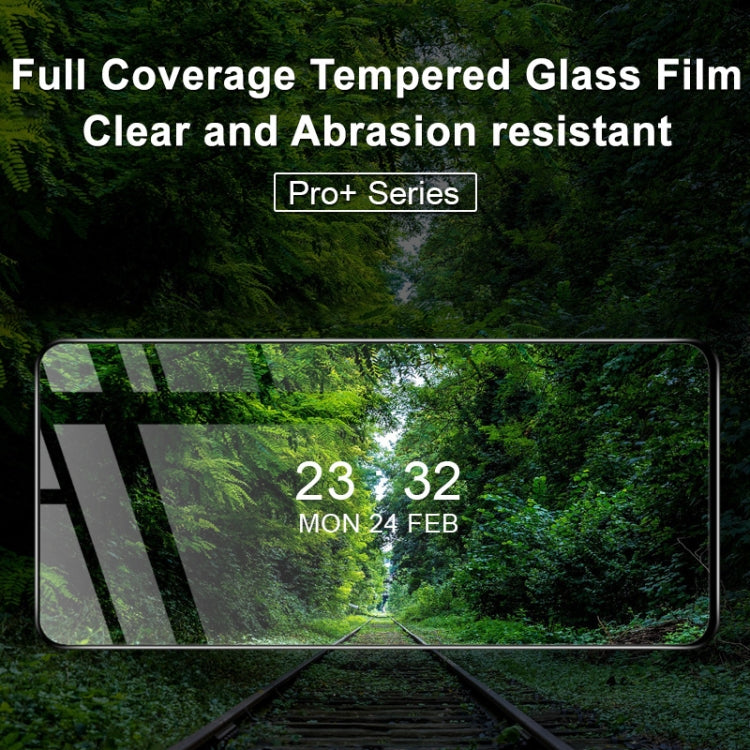 Full-screen tempered glass screen protector covering phone display, clear and glossy