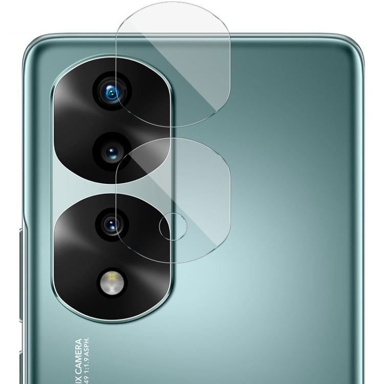 Clear rear camera lens film set on teal phone back, covers three camera lenses