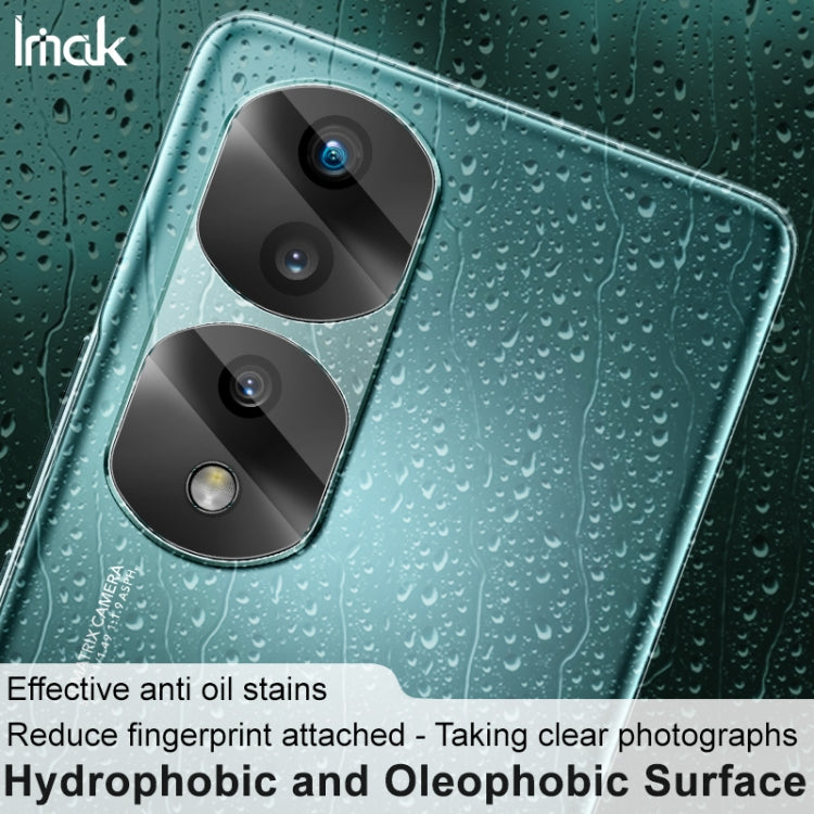 Clear rear camera lens film on teal phone back with three lens cutouts