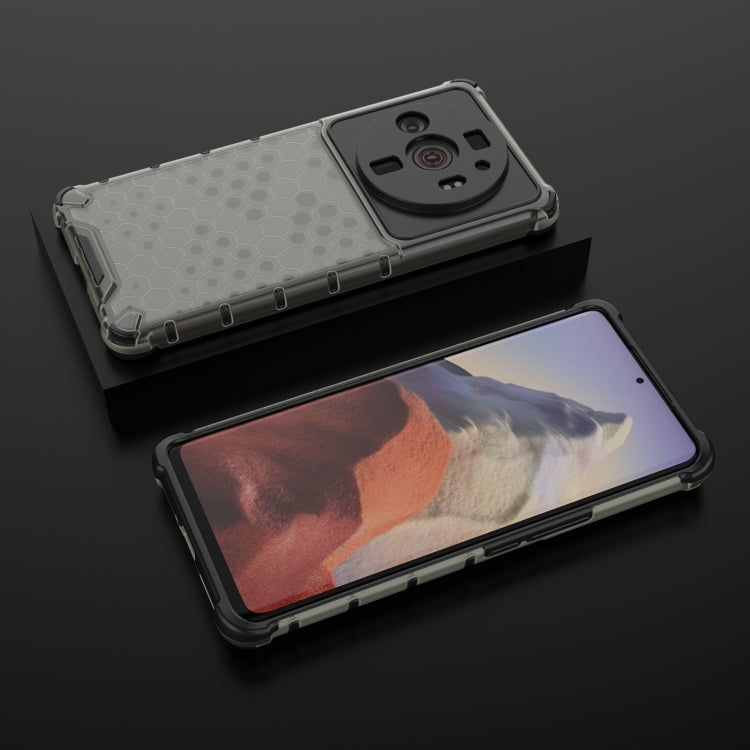 Shockproof honeycomb phone case with clear gray hex pattern, TPU bumper and raised edges