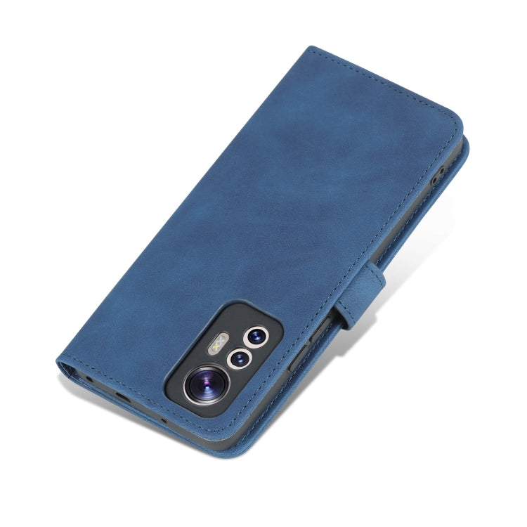 Blue leather flip phone case with camera cutout and side foldover closure