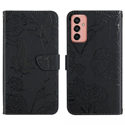 Black butterfly embossed flip leather phone case with strap and triple camera cutouts