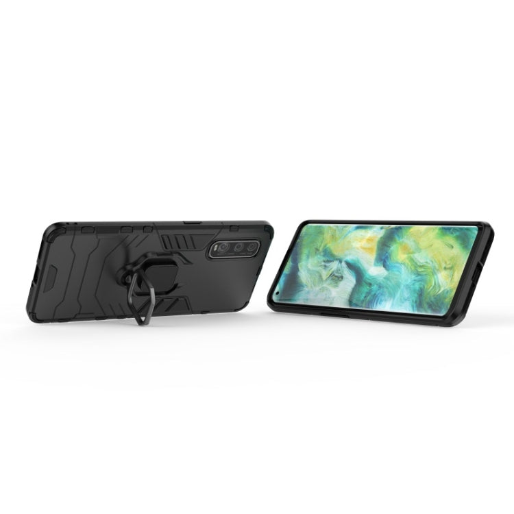 Black rugged phone case with magnetic ring holder, showing kickstand-style ring