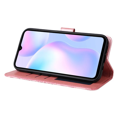 Pink embossed sunflower flip phone case used as a stand for landscape viewing
