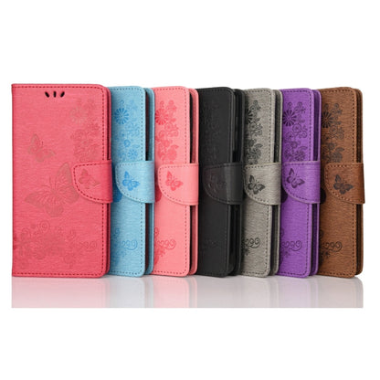 Assorted-color embossed butterfly flip phone cases lineup view