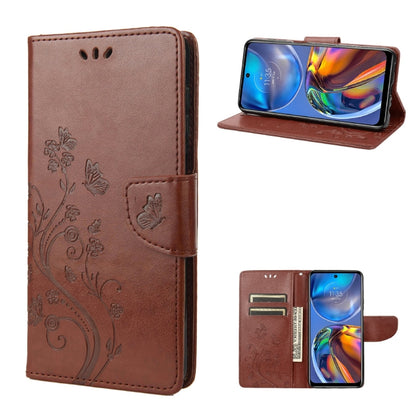 Brown leather flip phone case with butterfly floral pattern and card slot, stand view