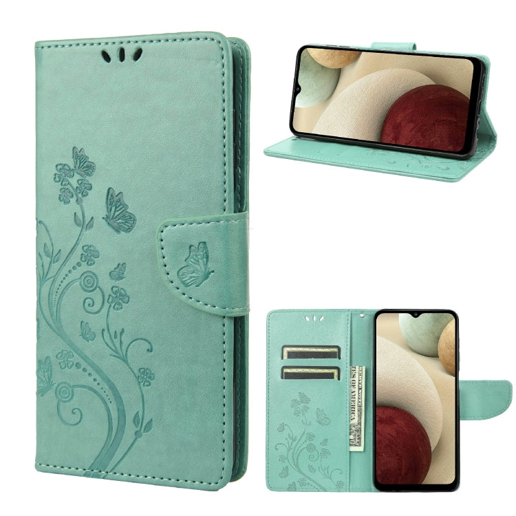 Teal leather flip phone case with butterfly floral pattern and card slot, stand view