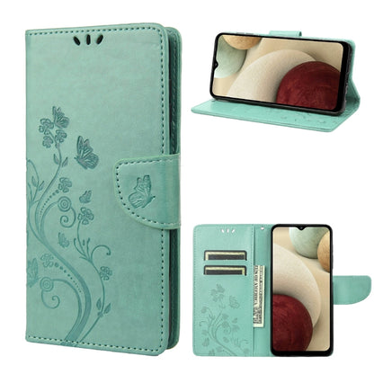 Teal leather flip phone case with butterfly floral pattern and card slot, stand view