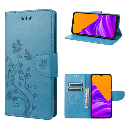 Light blue leather-style phone case with butterfly floral pattern, flip cover, and card slot