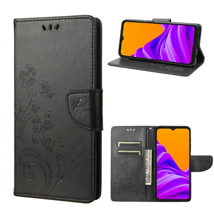 Dark charcoal leather-style phone case with butterfly floral pattern, flip cover, and card slot