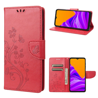 Coral pink leather-style phone case with butterfly floral pattern, flip cover, and card slot