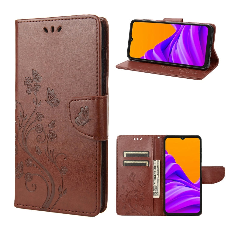 Brown leather-style phone case with butterfly floral pattern, flip cover, and card slot