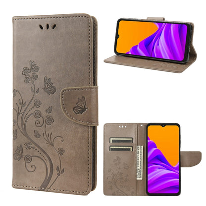 Beige leather-style phone case with butterfly floral pattern, flip cover, and card slot