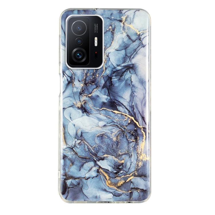 Blue marble TPU phone case with gold veining and raised camera cutouts for protection