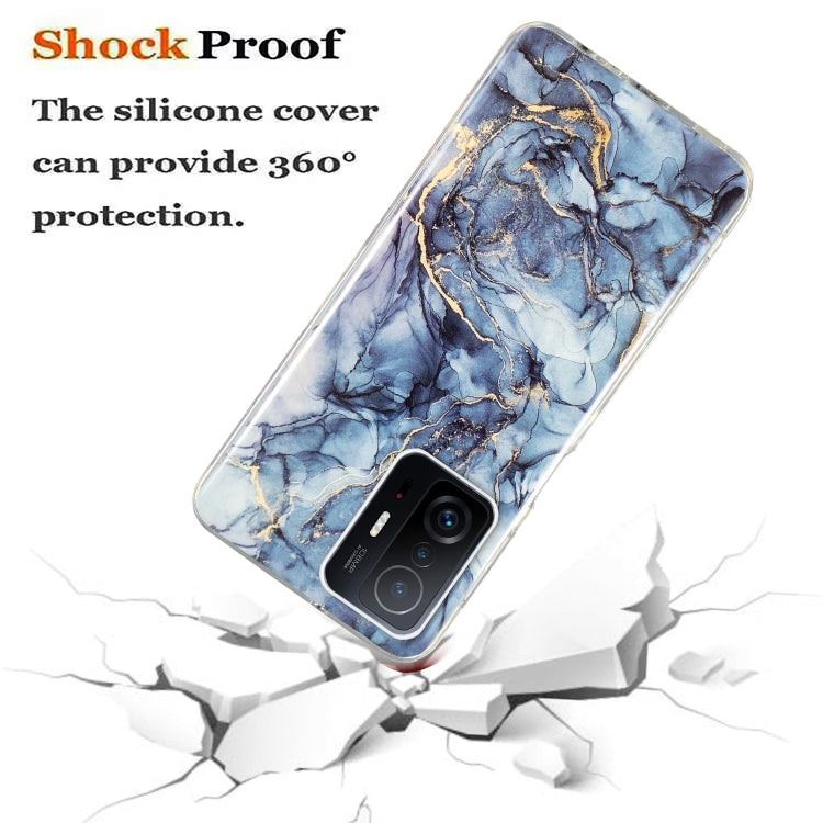 Blue marble TPU phone case with gold veining, raised camera cover, and shockproof design