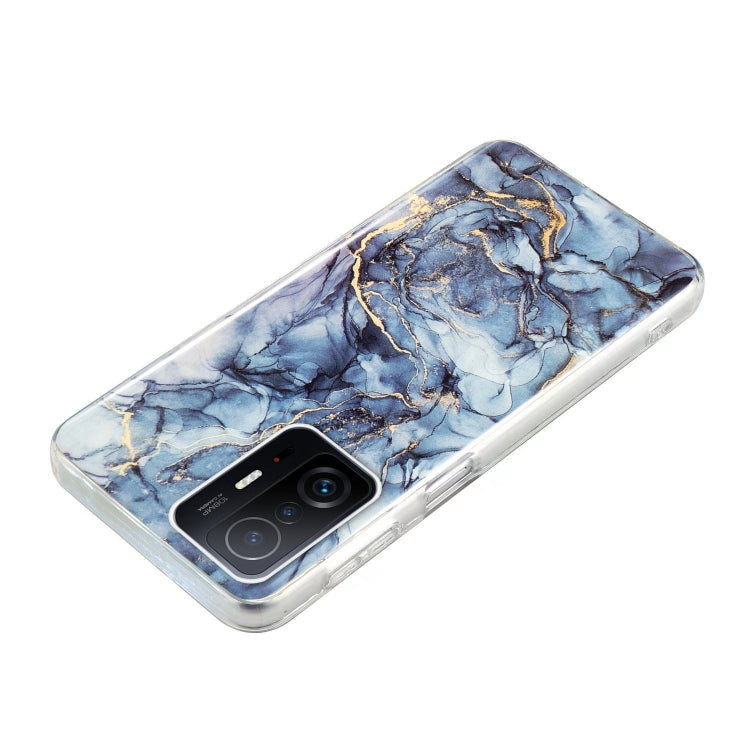 Blue marble TPU phone case with gold veins and camera cutout, clear protective edges