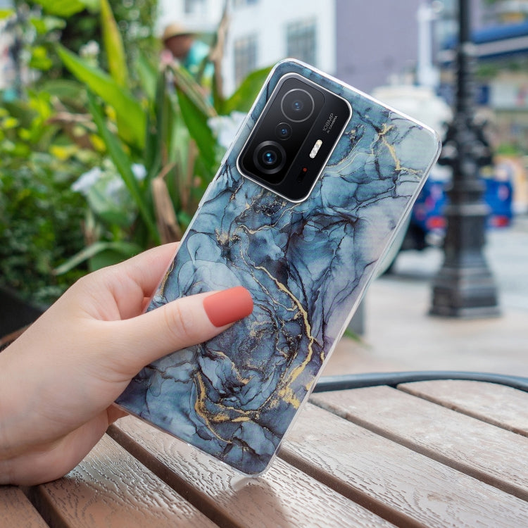 Blue marble TPU phone case with gold veining; visible camera module cutout