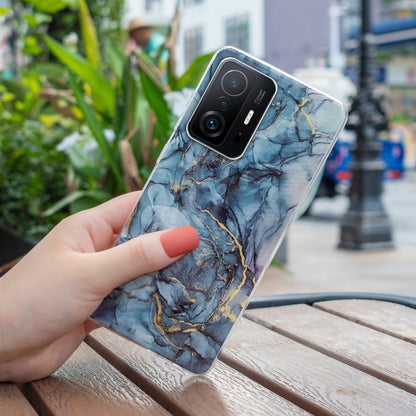 Blue marble TPU phone case with gold veining; visible camera module cutout
