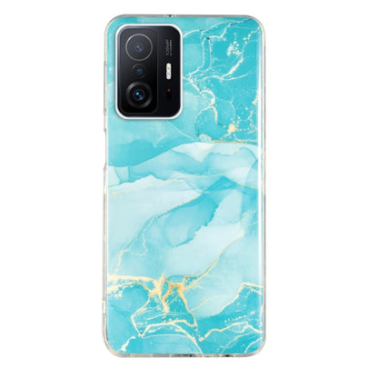 Turquoise blue marble TPU phone case with light gold lines and camera cutouts