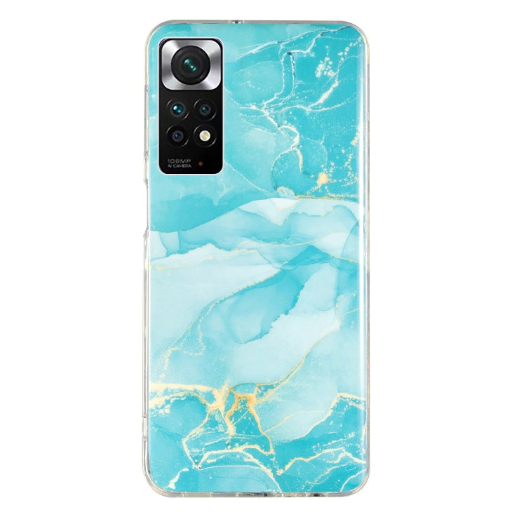 Marble pattern TPU phone case in turquoise marble with white swirls and camera opening