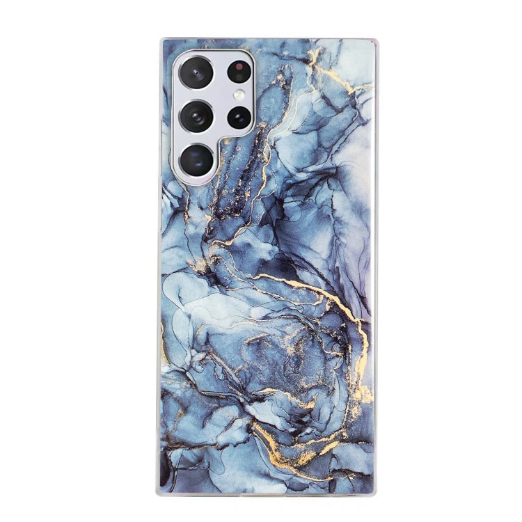Marble pattern TPU phone case with blue marbling and gold accents, camera cutouts