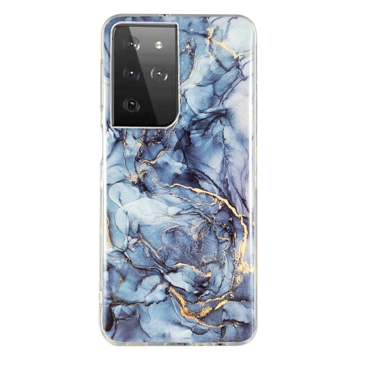 Marble pattern TPU phone case with blue stone veins and gold accents, clear edges