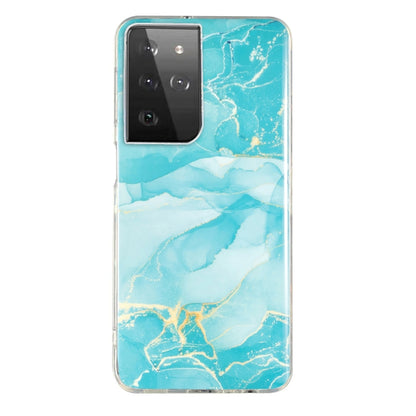 Marble pattern TPU phone case in light blue marbling with teal highlights, clear frame