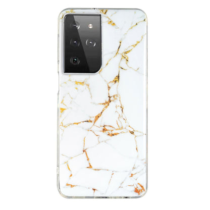 Marble pattern TPU phone case in white with gold and amber veining, clear edges