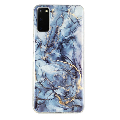 Marble pattern TPU phone case with light blue base, dark veins, and gold highlights
