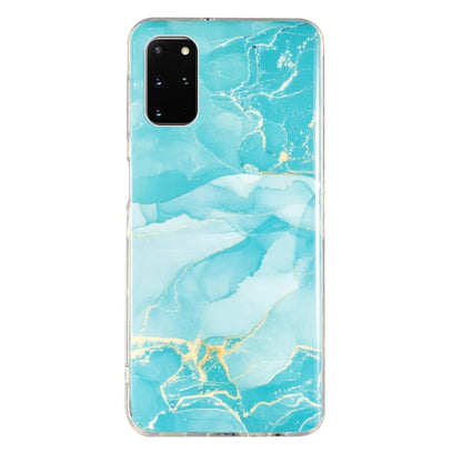 Marble-pattern TPU phone case with turquoise and white marbling, clear trim