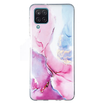 Marble pattern TPU phone case in pink and blue tones, with camera cutout and button ports.