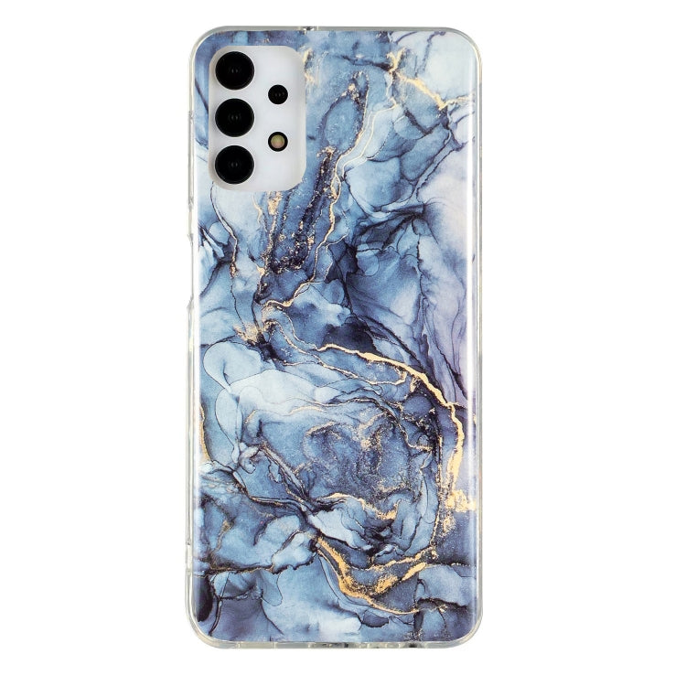 Marble-pattern TPU phone case with blue and gold swirls, raised camera cutouts