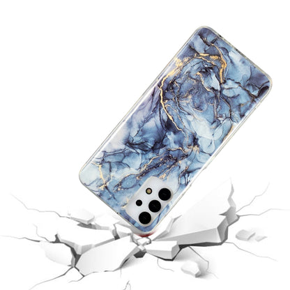 Marble-pattern TPU phone case with blue marble design, slim profile, camera cutouts