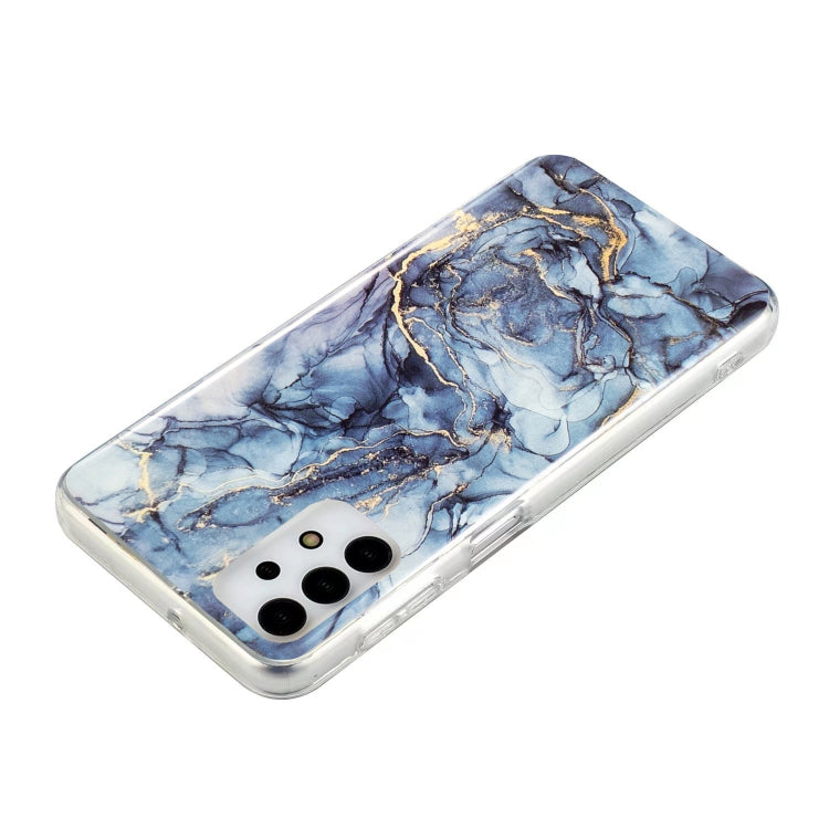 Blue marble TPU phone case with gold veins, clear edges, camera cutouts