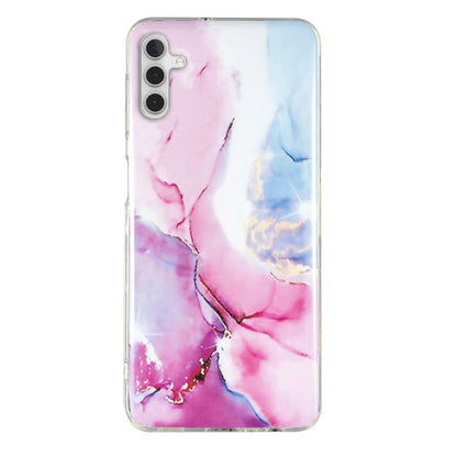 Pink and blue marble pattern TPU phone case with clear trim and cutouts for camera and ports.