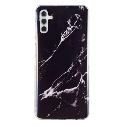 Black marble pattern TPU phone case with white veining and clear trim for camera and ports.