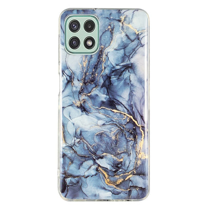 Marble-pattern TPU phone case, blue marble veining with gold accents and camera cutouts