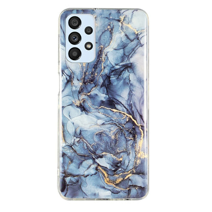 Marble-pattern TPU phone case, blue marble veining with gold accents and camera cutouts