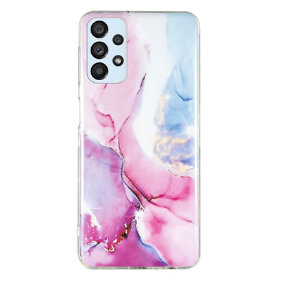 TPU phone case with pink and blue marble splash pattern, clear trim, camera cutouts