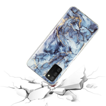 TPU phone case with blue marble design and gold veins, clear border, camera cutout