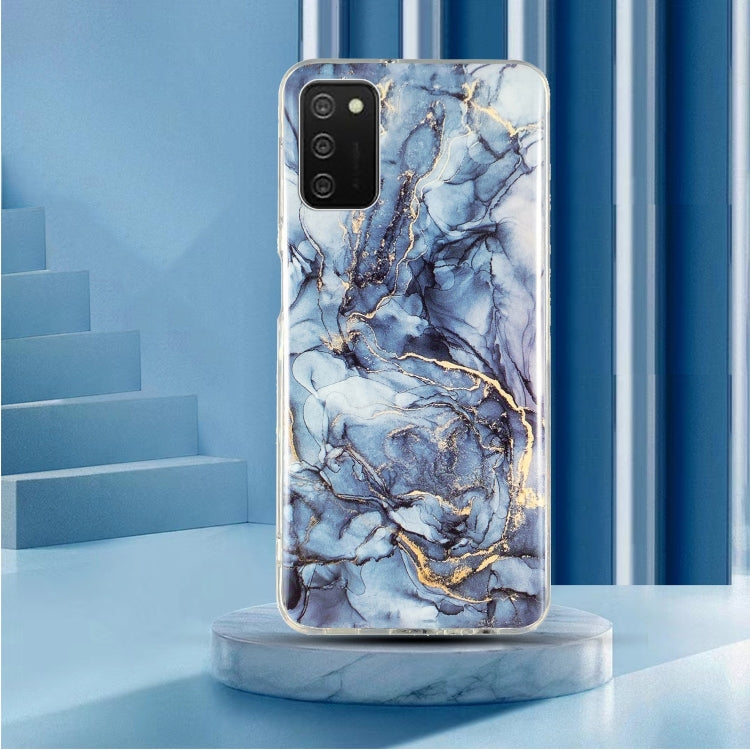 TPU phone case with blue marble pattern and gold accents, clear sides, camera cutout