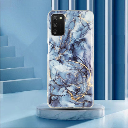 TPU phone case with blue marble pattern and gold accents, clear sides, camera cutout