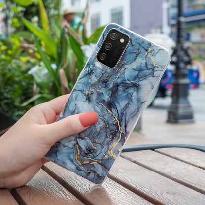 TPU phone case with blue marble and gold vein design, transparent edges, camera cutout