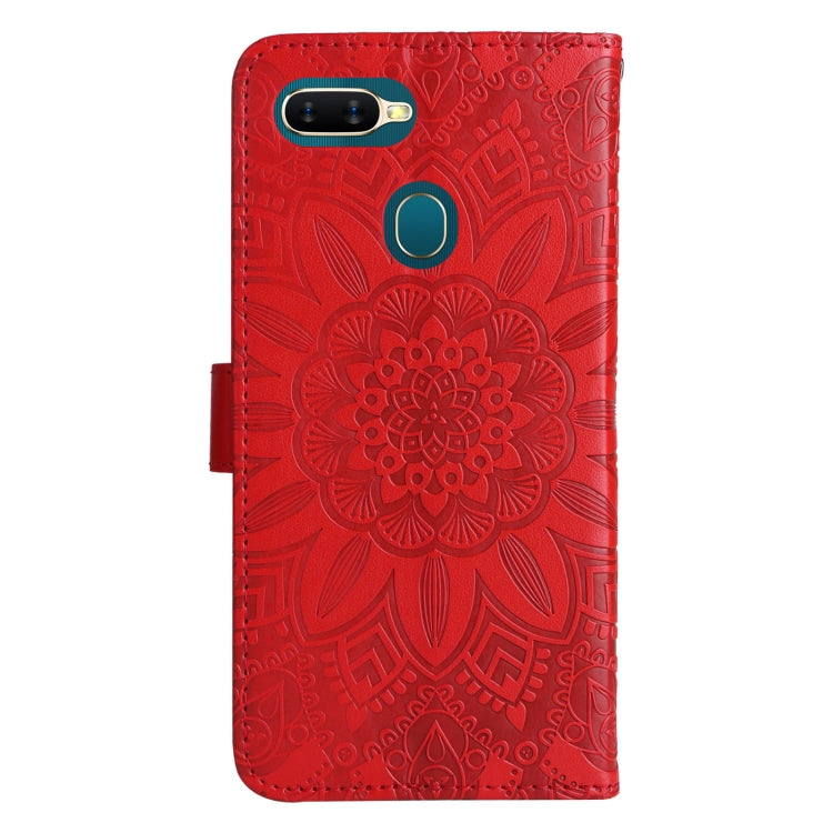 Red embossed sunflower leather phone case with camera cutout and side ring detail